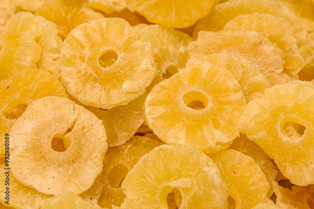 Dried preserved pineapple fruits. Background of the candied fruit slices Dried preserved pineapple fruits. Background of the candied fruit slices