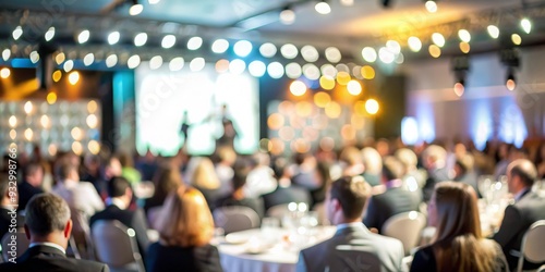 Blurred background of a corporate awards night with a stage and audience. 