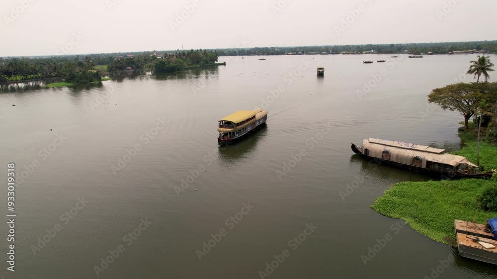 Houseboat Cruises Along Tranquil Canals In Alleppey, Kerala, Southern India. Aerial Drone view of houseboats in Alleppey. Travel, Vacation concept Houseboat Cruises Along Tranquil Canals In Alleppey, Kerala, Southern India. Aerial Drone view of houseboats in Alleppey. Travel, Vacation concept