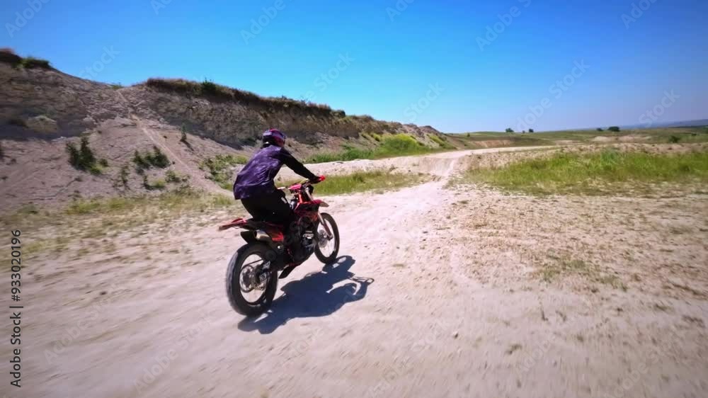 An enduro racer rides a cross-country bike with tricks at his home spot. Speedrump. FPV shot from drone motorcycle cross extreme sport adventure. Filmed on a sports FPV drone quadcopter An enduro racer rides a cross-country bike with tricks at his home spot. Speedrump. FPV shot from drone motorcycle cross extreme sport adventure. Filmed on a sports FPV drone quadcopter
