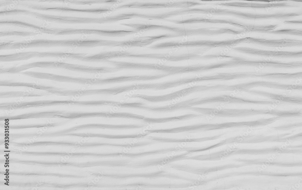 Fototapeta premium White cement wall curved with wave pattern. Modern design of white wavy background