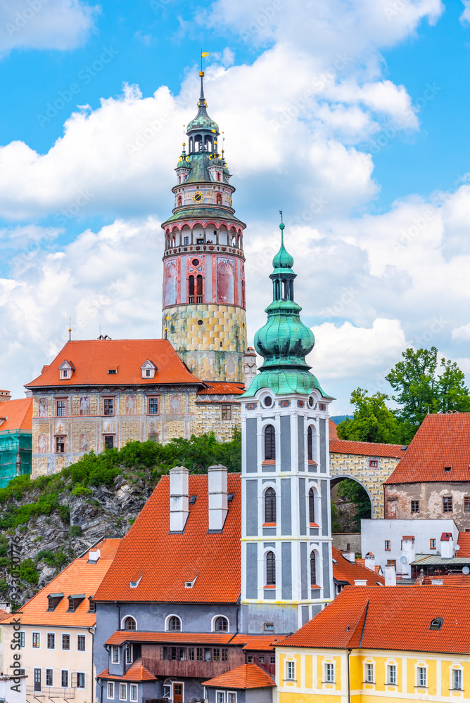 custom made wallpaper toronto digitalThe view showcases the historic Cesky Krumlov Castle Tower and the adjacent Bell Tower, set against a backdrop of vibrant blue skies and fluffy white clouds. Nestled atop a hill, the towers are