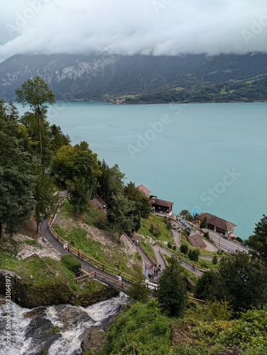 Swiss village waterfall above a lake