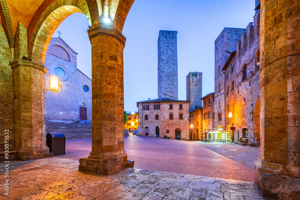 San Gimignano, Tuscany. Picturesque view of famous Piazza del Duomo with Torri Ardinghelli, Toscana - Italy.