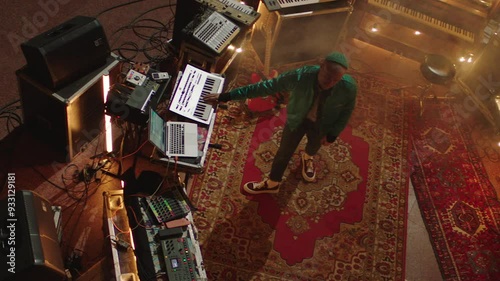 Top view of a DJ setup in a church and a DJ in the middle playing instruments