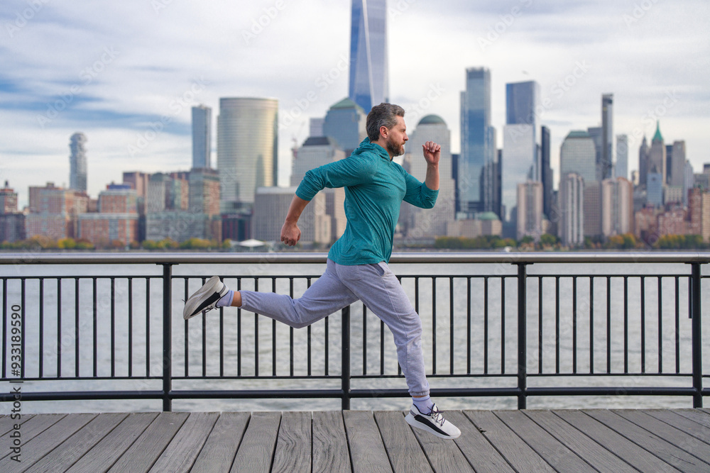Runner man. Healthy sport. Man running in New York City. Fitness man runner is jogging near Manhattan. Guy running on American street. Man running in New York in sport clothes. Sport wear for runners. Runner man. Healthy sport. Man running in New York City. Fitness man runner is jogging near Manhattan. Guy running on American street. Man running in New York in sport clothes. Sport wear for runners.
