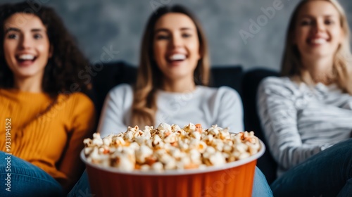 Group of friends enjoying spooky Halloween films together photo