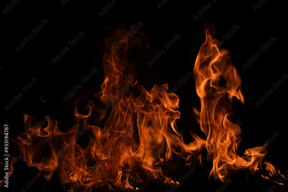 Texture of fire on a black background. Abstract fire flame background, large burning fire. Texture of fire on a black background. Abstract fire flame background, large burning fire.