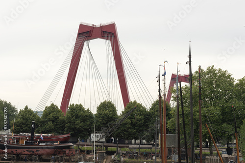 Willems bridge in Rotterdam, view from Haringvliet in the direction of the bridge. Parts of boats and sea mast in the foreground. photo