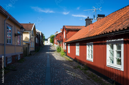 Old town in Sweden, Traditional red wooden houses in Gamla Gefle quarter of Gävle city on summer sunny day