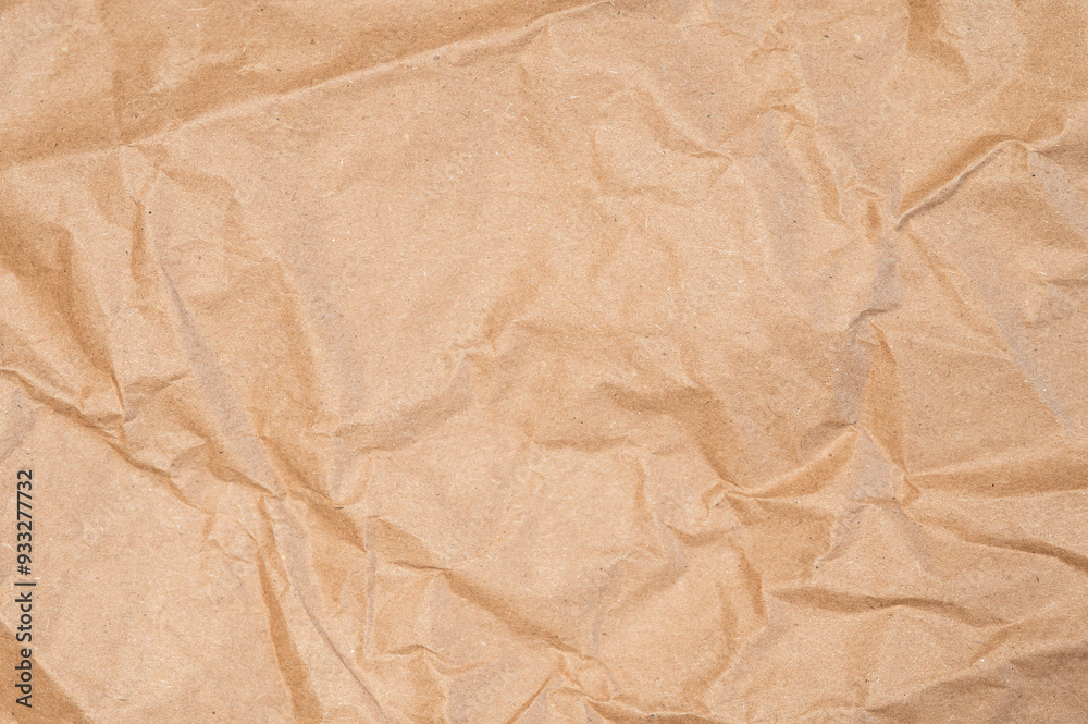 Craft wrapping paper texture of flat crumpled sheet of cellulose products. Old tattered page surface background. Eco-friendly empty aged recyclable packaging Craft wrapping paper texture of flat crumpled sheet of cellulose products. Old tattered page surface background. Eco-friendly empty aged recyclable packaging