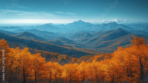 Scenic view of a vibrant autumn mountain range with golden foliage in a clear blue sky