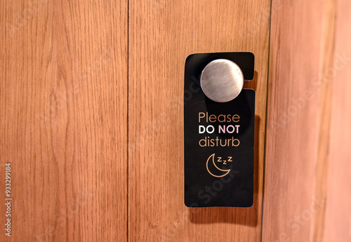 Please do not disturb sign on the door of hotel room. 