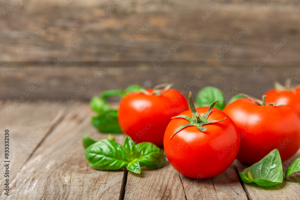 Fresh cherry tomatoes and fresh green basil on a textured background. Tomato sauce. Vegan. Ingredients for salad. Organic food. Place for text. Copy space. Fresh cherry tomatoes and fresh green basil on a textured background. Tomato sauce. Vegan. Ingredients for salad. Organic food. Place for text. Copy space.
