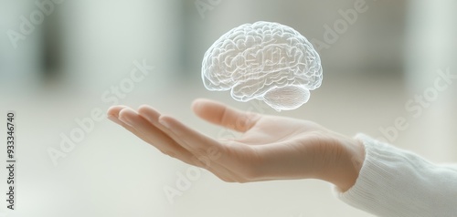 A hand cradling a brain symbolizes the fusion of creativity and intelligence. This abstract concept blends innovation, technology, and art, representing genius thinking and a new perspective on wisdom