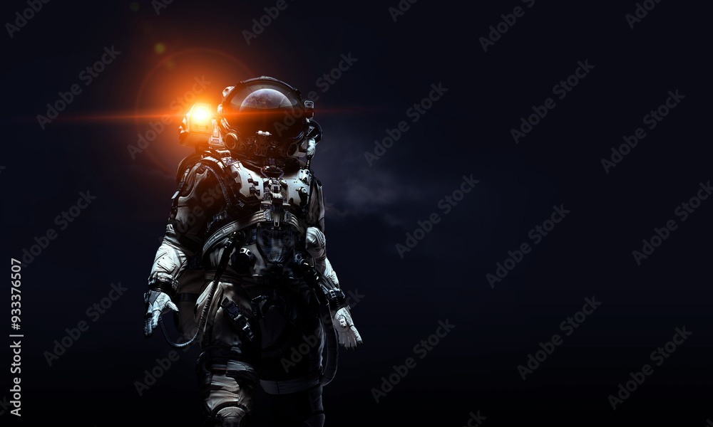 Fototapeta premium Astronaut in suit against black background. Space technology concept