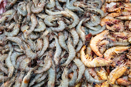 Raw prawns top view on the counter at fish market