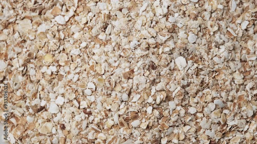 Close up top view of rotation oat flakes. Granola oat breakfast cereals. Healthy vegan morning meal for diet and weight loss. Gastronomy concept, organic food. Breakfast from oat grains, oatmeal Close up top view of rotation oat flakes. Granola oat breakfast cereals. Healthy vegan morning meal for diet and weight loss. Gastronomy concept, organic food. Breakfast from oat grains, oatmeal
