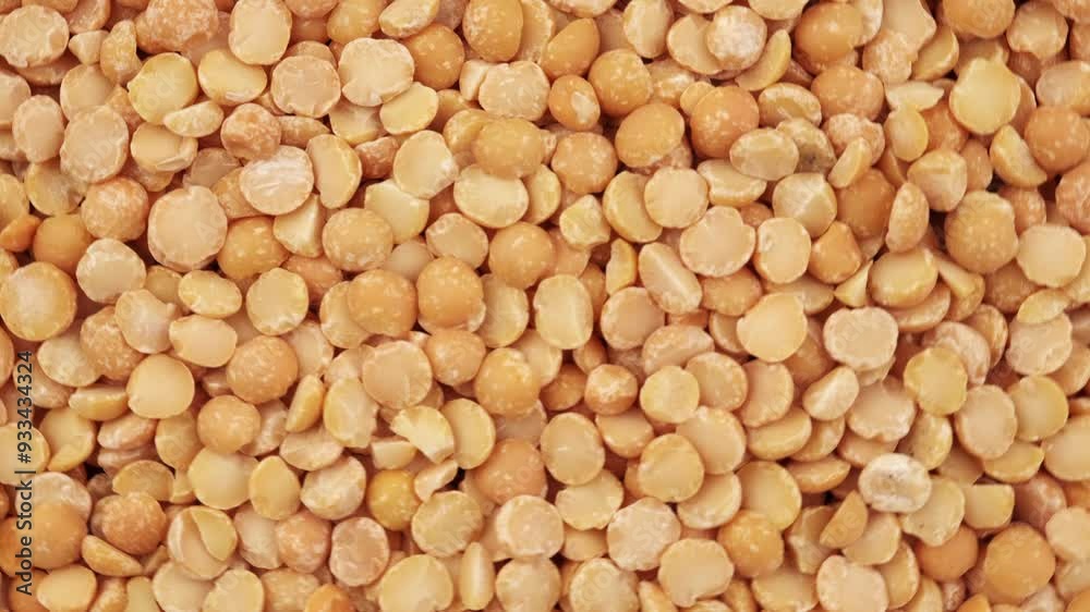 Round yellow peas for cooking porridge, raw yellow peas scattered before cooking. Healthy food concept. Top view of rotation dried yellow peas Round yellow peas for cooking porridge, raw yellow peas scattered before cooking. Healthy food concept. Top view of rotation dried yellow peas