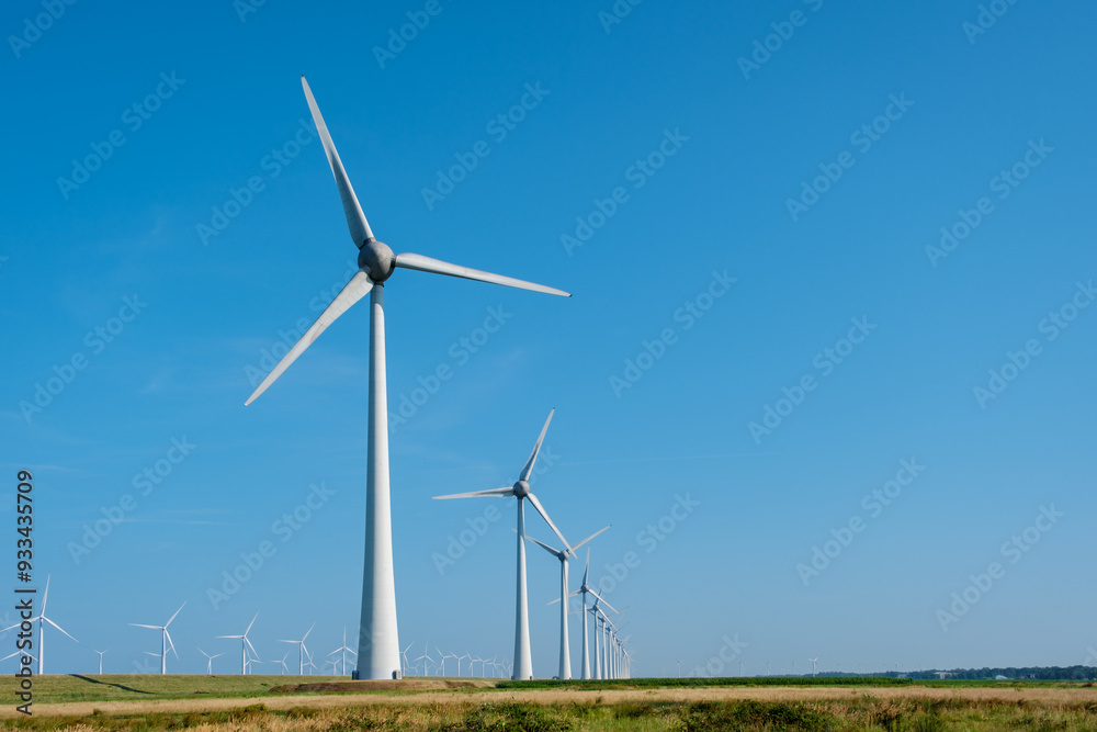 Majestic Windmill Park in the Netherlands Under Bright Blue Sky Majestic Windmill Park in the Netherlands Under Bright Blue Sky