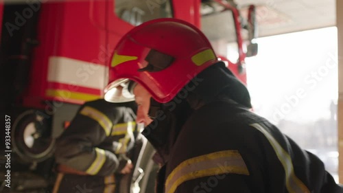 Bald firefighter preparing to do his job