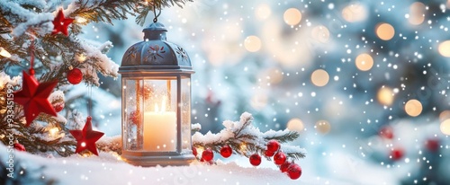 Christmas background with lantern, snow, and decorations on blue backdrop. Stars, lights, pine branches, bokeh effect.