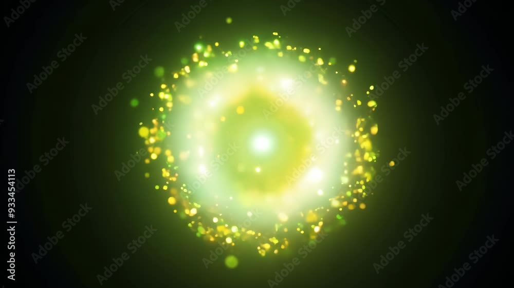 Green-yellow particles forming circular pattern with bokeh on black background Green-yellow particles forming circular pattern with bokeh on black background