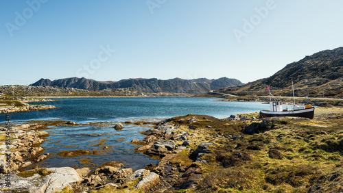 view of the village of Gjesvaer during a sunny spring day, north Cape, mageroya island, Norway photo