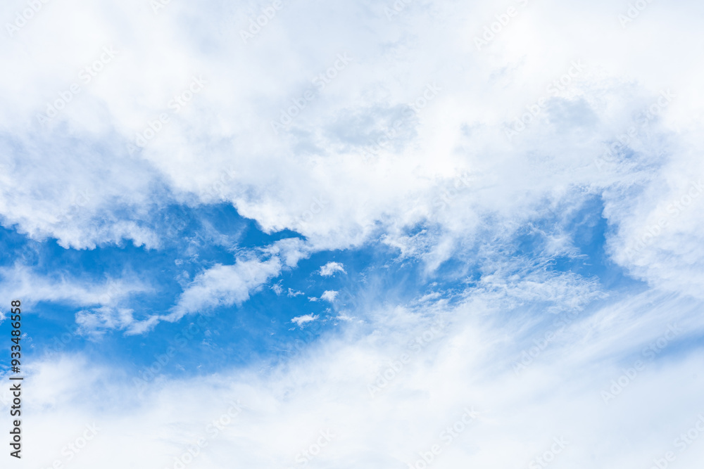 Bright blue sky with fluffy white clouds on a sunny day Bright blue sky with fluffy white clouds on a sunny day