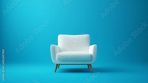 A white couch sits in front of a blue wall