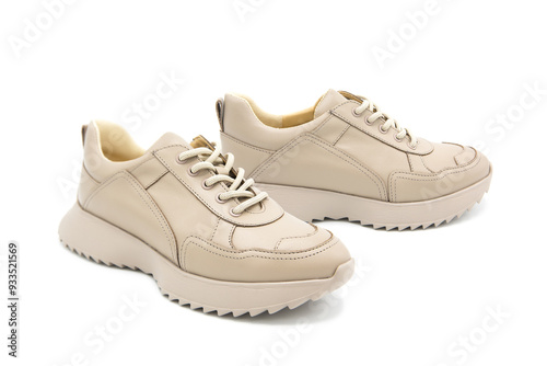 Sneakers. Pair of fashionable leather sports shoes isolated on white background. View from all sides.