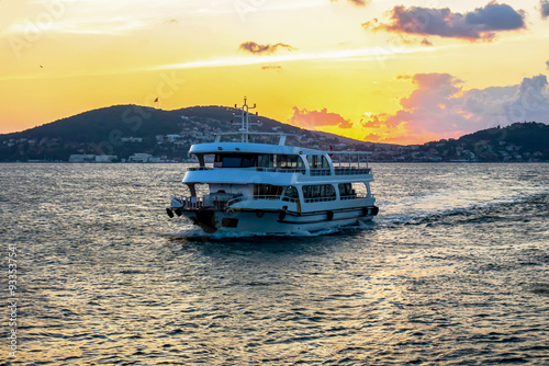 sunset view of  islands and moving boat on the sea in istanbul photo