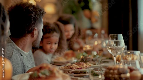 4K video of a family gathered around a table for Thanksgiving dinner, turkey, stuffing, festive, pumpkin pie