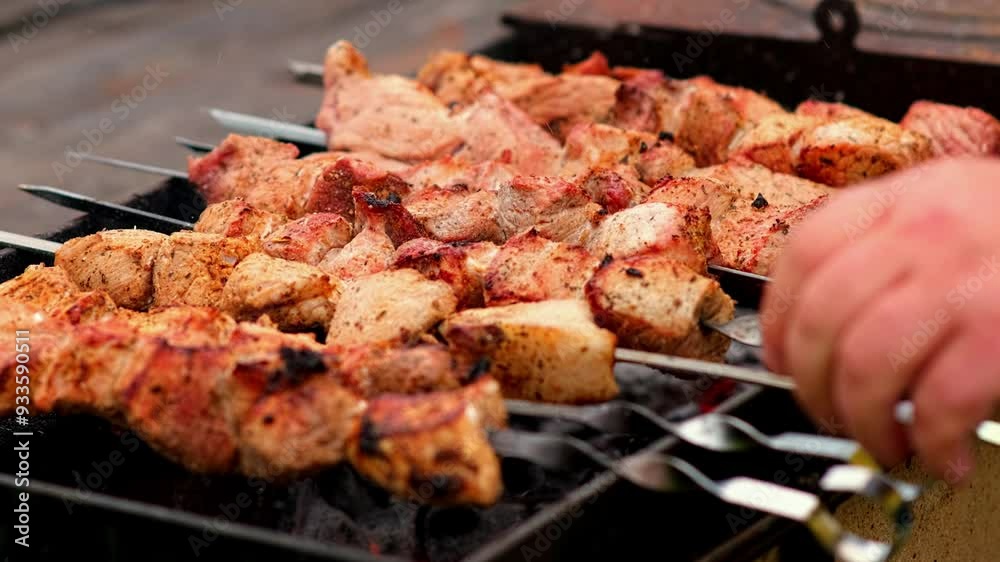 Close-up of sizzling kebabs on skewers grilling over an open flame. Perfect for showcasing outdoor cooking and barbecue flavors. Close-up of sizzling kebabs on skewers grilling over an open flame. Perfect for showcasing outdoor cooking and barbecue flavors.