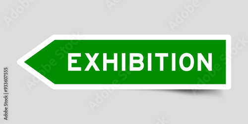 Green color arrow shape sticker label with word exhibition on gray background