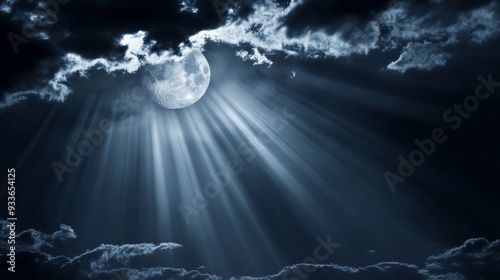 A moonlit night. Thin clouds obscure most of the moon, but rays of light shine through.
