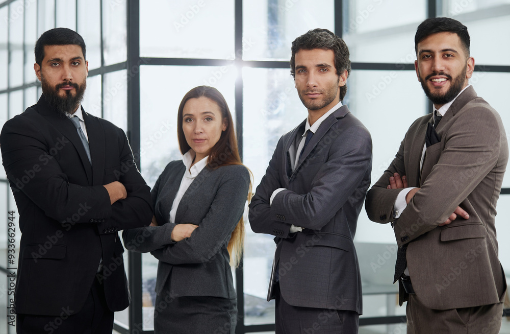 Portrait of four office workersr arms over their chest. Portrait of four office workersr arms over their chest.