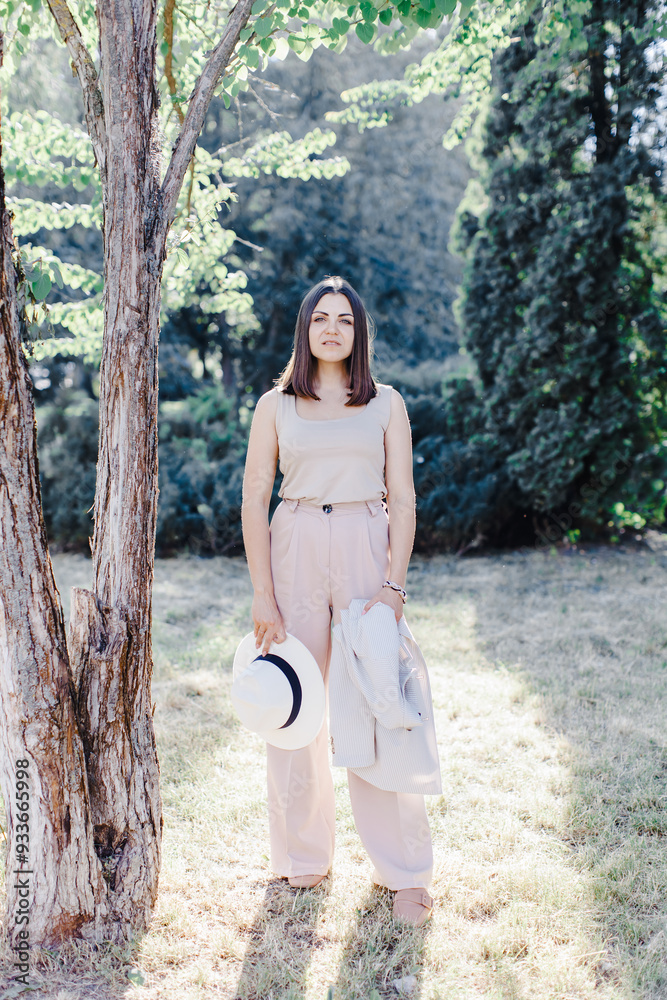 Full body portrait of caucasian confident business woman in suit, walking in park Full body portrait of caucasian confident business woman in suit, walking in park