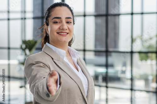 Young woman business worker shak hand at office photo