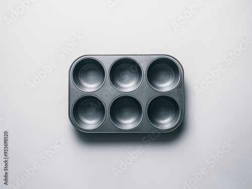 muffin tin against white background  