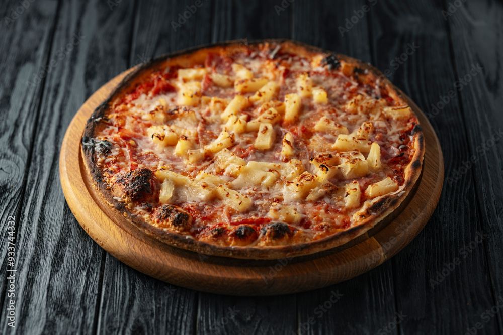 Hawaiian pizza close up on wooden dark background, Italian pizza Hawaiian pizza close up on wooden dark background, Italian pizza