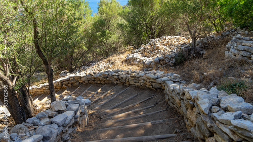 Wooden staircase in ancient city Amos near town or village of Turunc, Turkey. It was located in Rhodian Peraia in Caria on Mediterranean coast photo