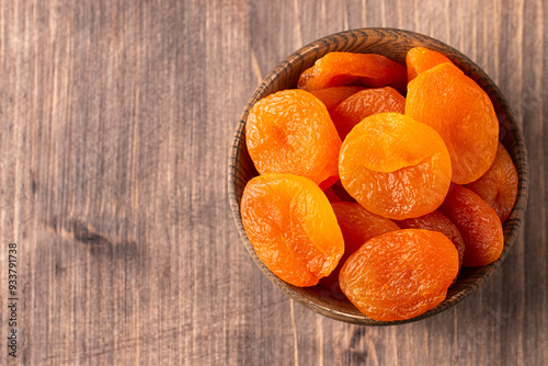 Obraz na plátně Dried apricots in a bowl. Dried fruits.