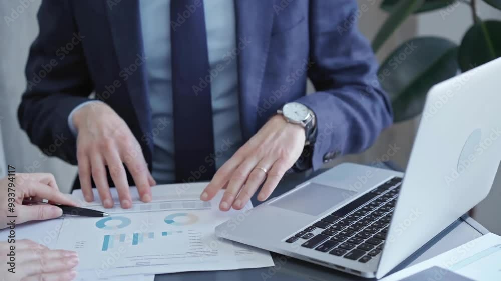 Two professionals analyzing a pie chart during a strategic business meeting. Business meeting with graph analysis Two professionals analyzing a pie chart during a strategic business meeting. Business meeting with graph analysis