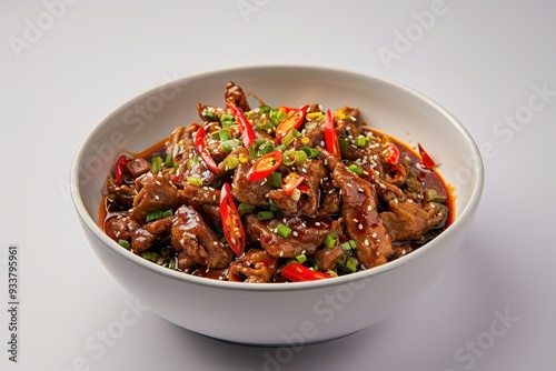 Stir-fried Meat with Chili Peppers and Sesame Seeds in a White Bowl