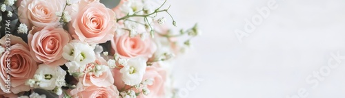 A beautiful bouquet of soft pink roses and white flowers, creating an elegant and delicate composition.