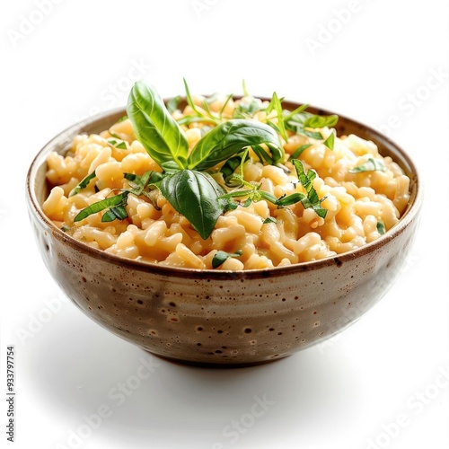 Bowl of cooked pasta with fresh herbs and pepper.