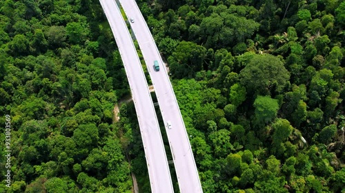 Aerial view of the Tree Giam Kanching bypass highway winding through the mountains of Rawang, Selangor, Malaysia surrounded by greenery. photo