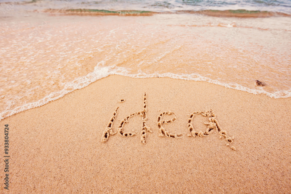 Fototapeta premium the inscription Idea on the seashore with palm trees