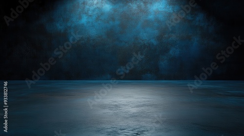 A dark, moody blue studio background with textured walls and floor illuminated by spotlight.